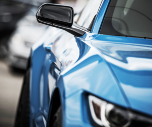 A close-up of a shiny, blue car.