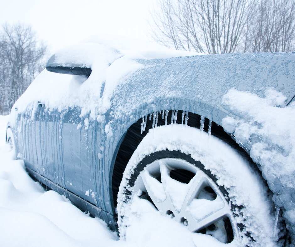Why You Should Wax In The Winter- A blue car is covered in snow and icicles