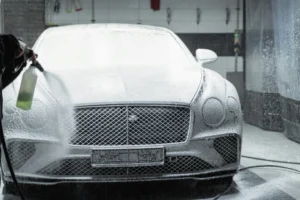 Car getting cleaned with soap